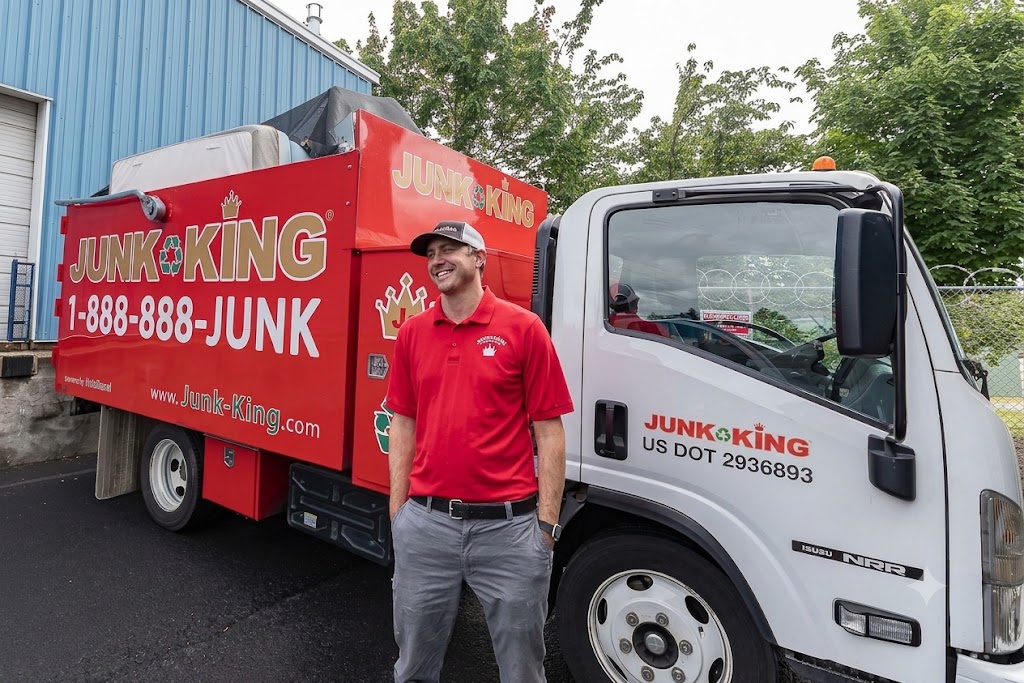 Team loading junk onto a truck