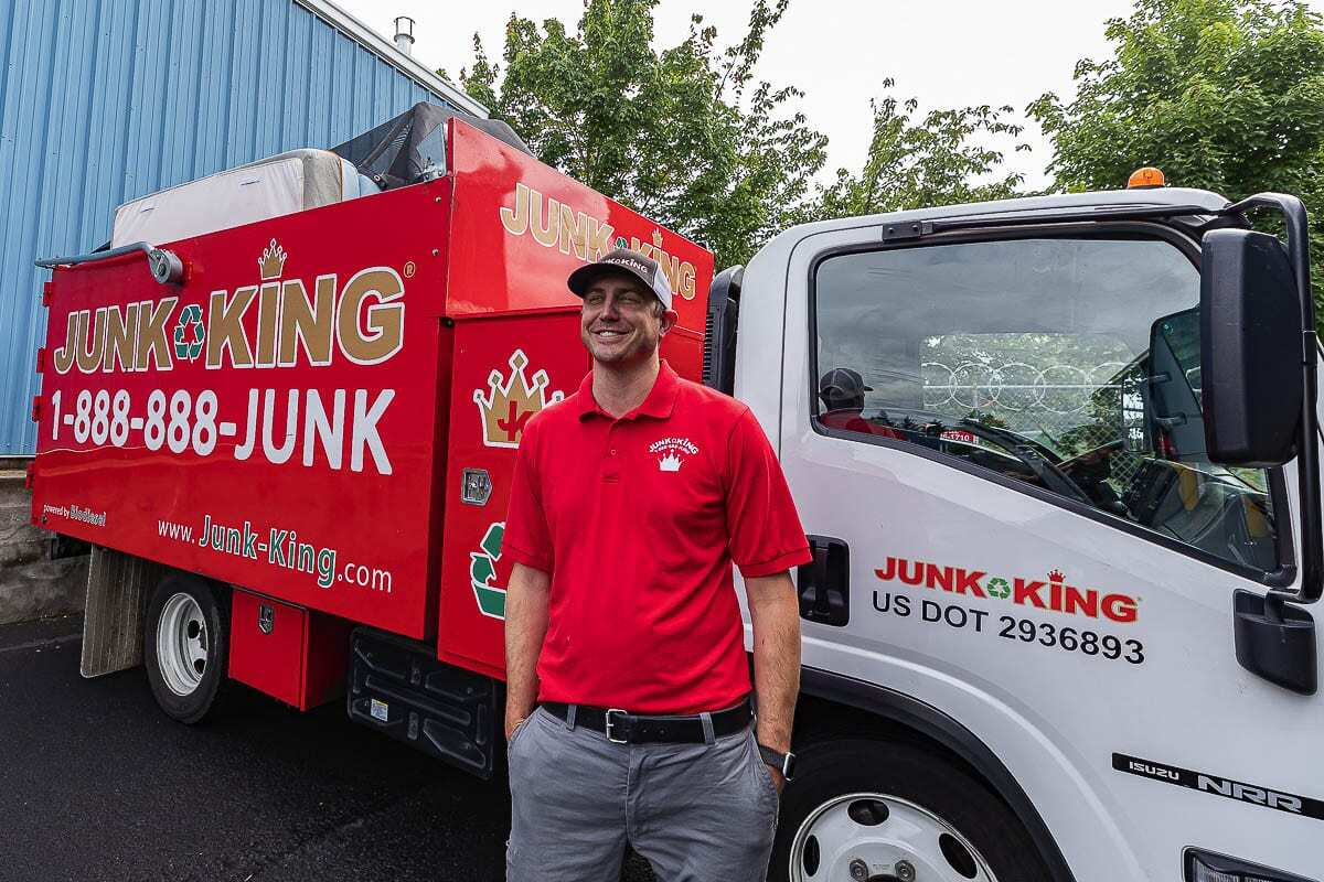 Team loading junk onto a truck